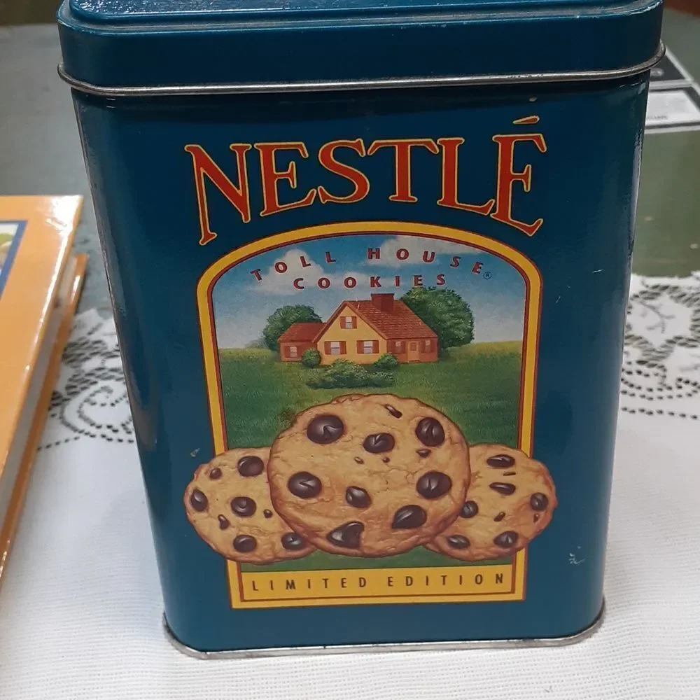 3-pc. Nestle's chocolate bundle: 2‎ vintage tins and a hardcover cookbook